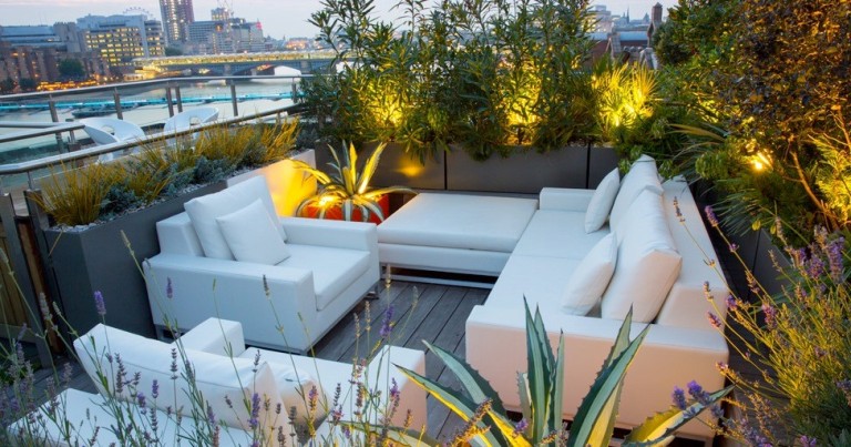 very-small-rooftop-garden-and-patio-design-with-white-leather-sofa-and-petrie-chairs-with-ottoman-plus-romantic-floor-lighting-ideas